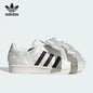 Sneakers bianche vintage Adidas Shell Toe con grande fiocco in raso jacquard goffrato, scarpe casual alla moda JR7977