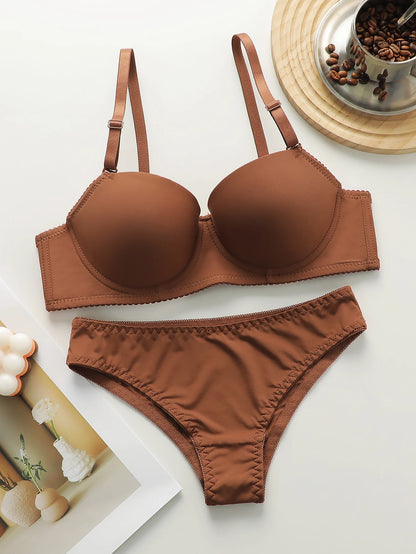 Nuovo set da 2 pezzi quotidiano in tinta unita di vendita calda con reggiseno push up con bordo in acciaio per set intimo donna J2611