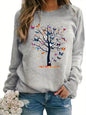 Maglione da donna, ideale per l’autunno e l’inverno, dal taglio ampio e confortevole, caldo, con stampa a motivi di farfalle e alberi, scollo rotondo e maniche lunghe.
