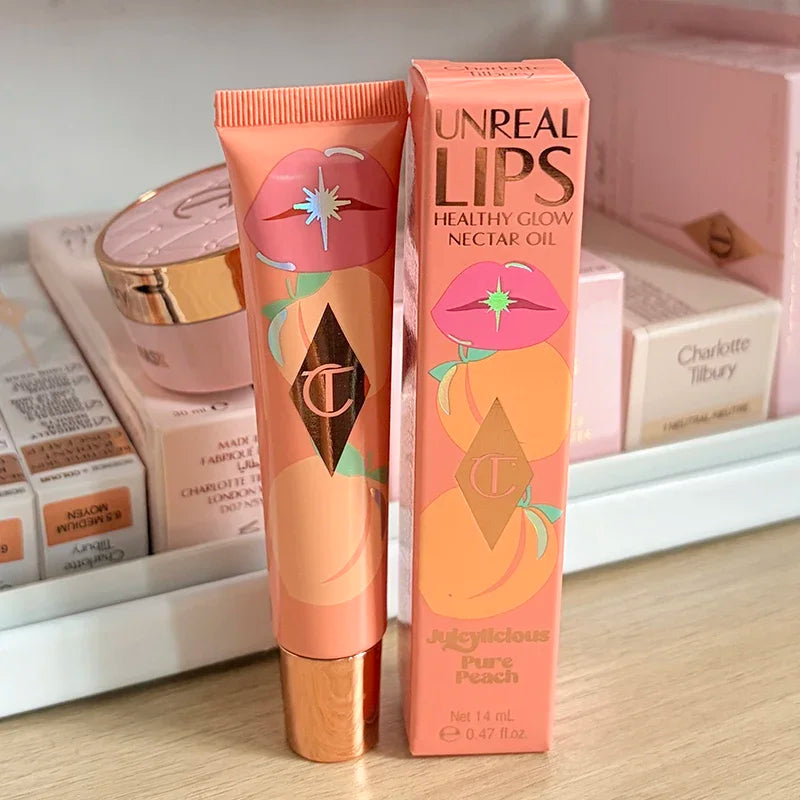 Charlotte, lucidalabbra al gusto di frutta, blush in polvere colorata, stick, tubetto rosa e oro, rossetto facile da applicare, Tilbury Cosmetics.