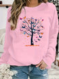 Maglione da donna, ideale per l’autunno e l’inverno, dal taglio ampio e confortevole, caldo, con stampa a motivi di farfalle e alberi, scollo rotondo e maniche lunghe.