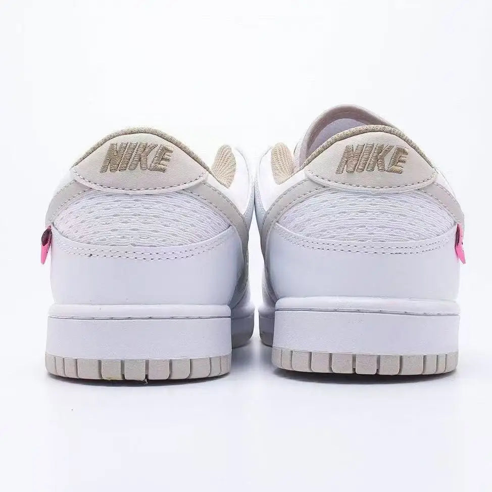 Sneakers basse Nike bianche e grigio chiaro con dettagli rosa menta, pannelli in rete per una maggiore traspirabilità, modello casual alla moda DX6060-121