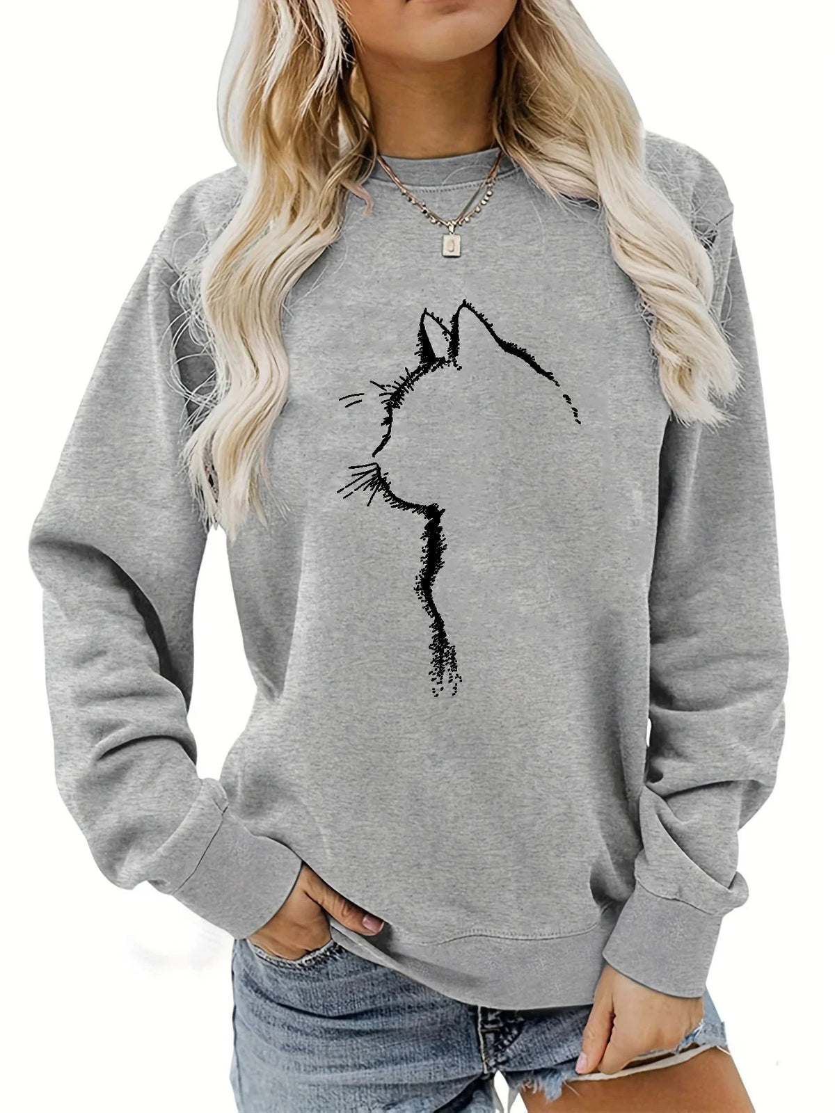 Maglione da donna, ideale per l’autunno e l’inverno, dal taglio ampio e confortevole, con stampa a motivi felini, scollo rotondo e maniche lunghe.