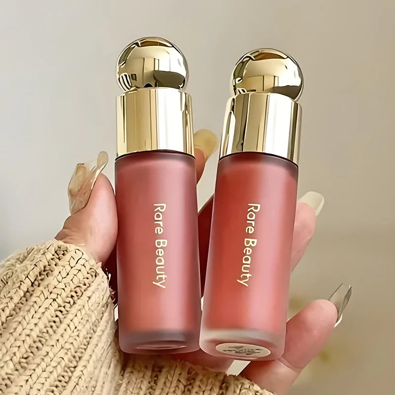 Balsamo per labbra multicolore in stick, blush liquido in polvere, linea di cosmetici Rare Beauty, Believe Happy Bliss, a lunga tenuta, facile da applicare, per un trucco impeccabile.