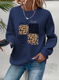Maglione da donna, ideale per l’autunno e l’inverno, dal taglio ampio e confortevole, con stampa a motivi felini, scollo rotondo e maniche lunghe.