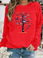 Maglione da donna, ideale per l’autunno e l’inverno, dal taglio ampio e confortevole, caldo, con stampa a motivi di farfalle e alberi, scollo rotondo e maniche lunghe.