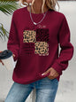 Maglione da donna, ideale per l’autunno e l’inverno, dal taglio ampio e confortevole, con stampa a motivi felini, scollo rotondo e maniche lunghe.
